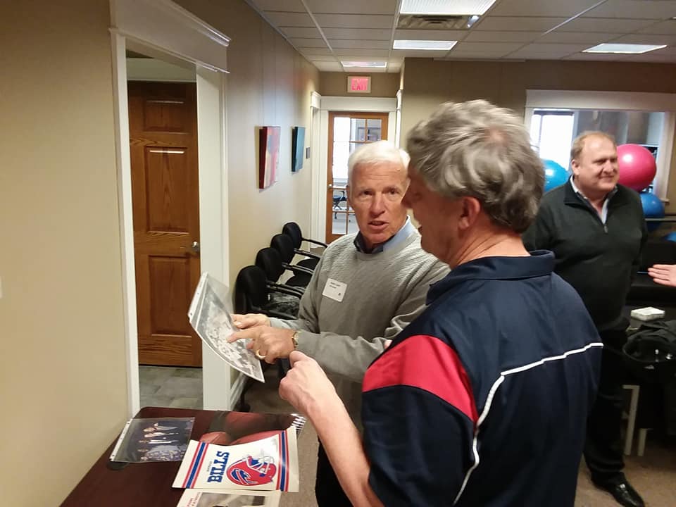 Denny Lynch (L) and Greg Tranter discuss football history.